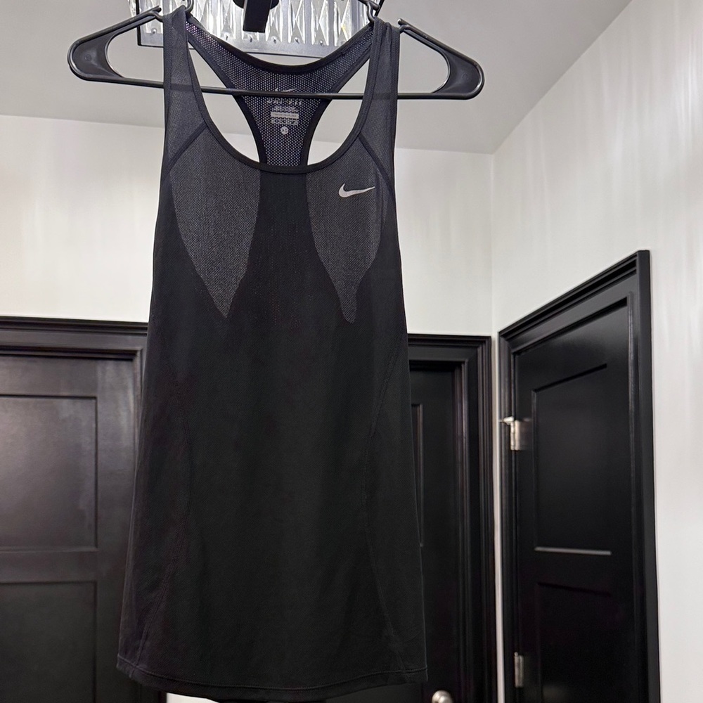 This is a black Nike Dri-FIT running or training tank top.